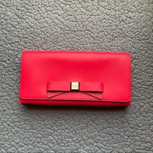 Neon Pink Kate Spade clutch